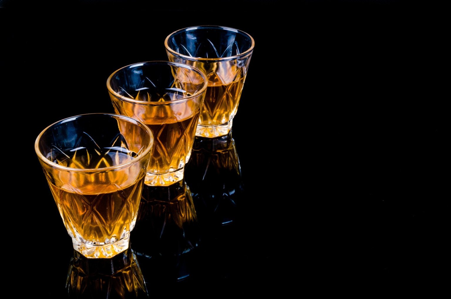 Glasses of Liquor in Black Background